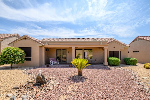 rear view of house featuring a patio