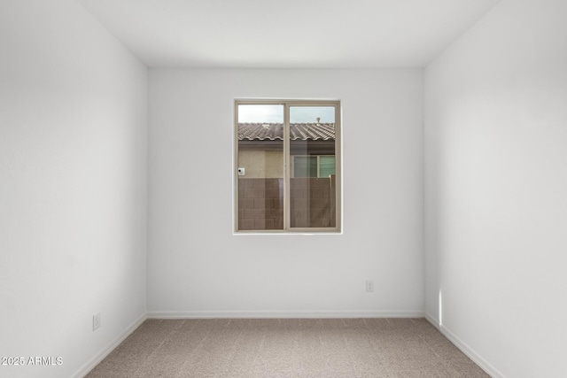 unfurnished room with carpet flooring