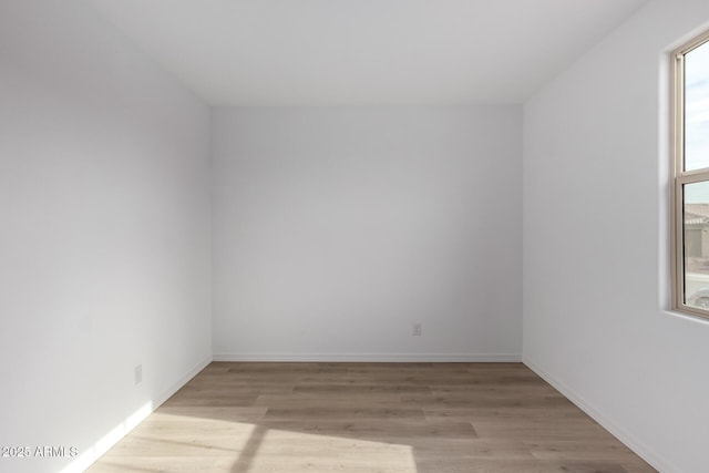 unfurnished room featuring light hardwood / wood-style floors