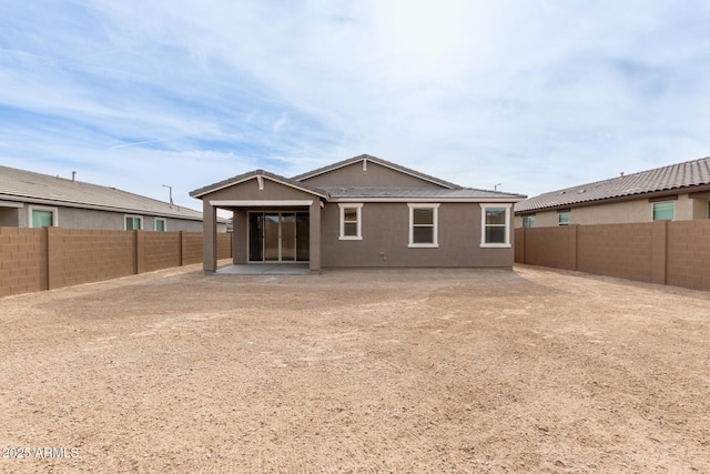 back of house featuring a patio