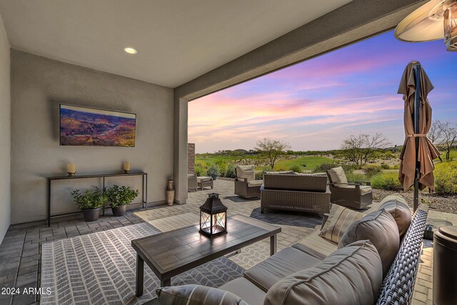 patio terrace at dusk with an outdoor living space