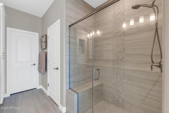 bathroom featuring an enclosed shower