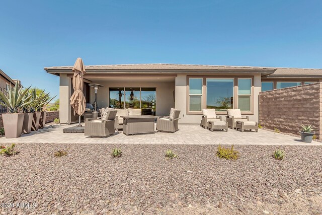 back of house featuring an outdoor hangout area and a patio area