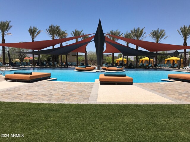 view of swimming pool with a patio area