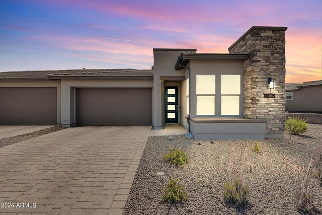 prairie-style home featuring a garage