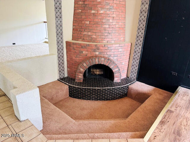 4727 E Euclid Ave, Phoenix, AZ 85044 - detailed view of a brick fireplace and wood finished floors