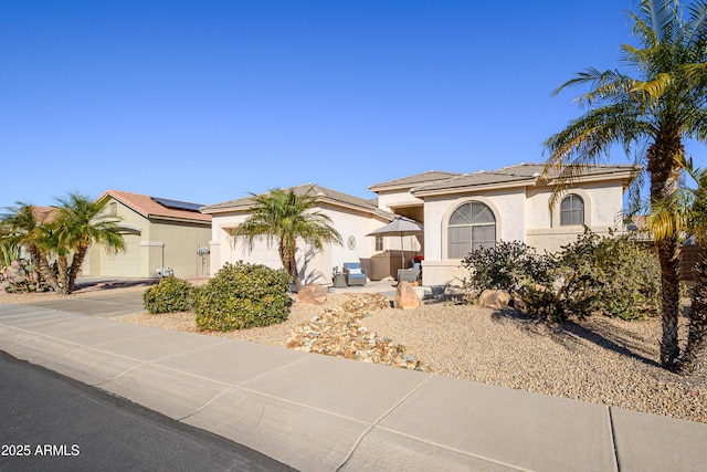 mediterranean / spanish house featuring a garage