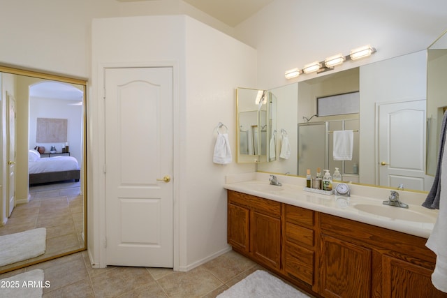 bathroom featuring tile patterned floors, vanity, and walk in shower