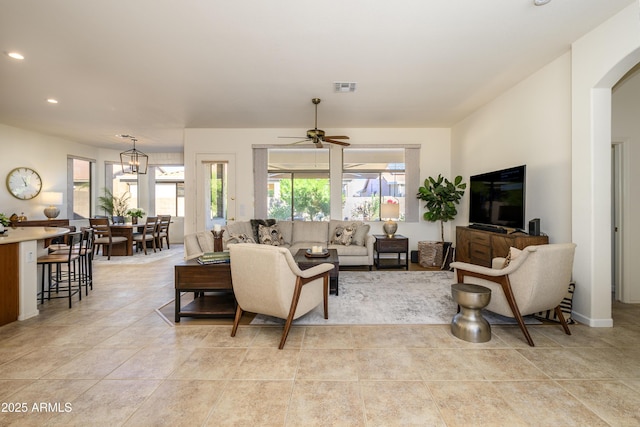 tiled living room with ceiling fan