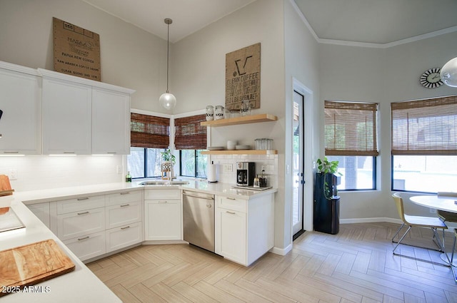 1750 E Mallory St, Mesa, AZ 85203 - kitchen with stainless steel dishwasher, tasteful backsplash, white cabinetry, light countertops, and a towering ceiling