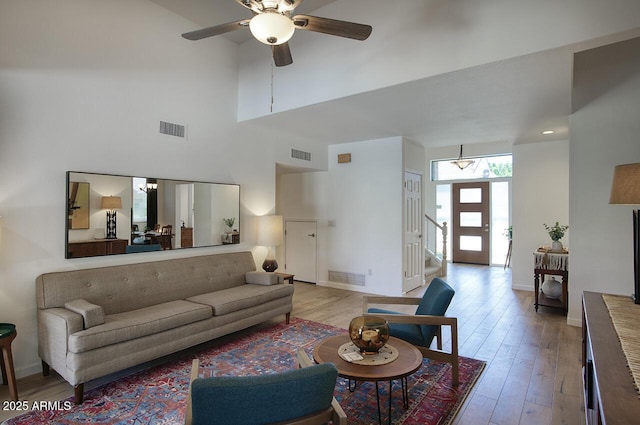 1750 E Mallory St, Mesa, AZ 85203 - living area with a high ceiling, a ceiling fan, wood finished floors, and stairs