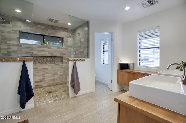 1750 E Mallory St, Mesa, AZ 85203 - full bath with a walk in shower, recessed lighting, wood finished floors, and vanity