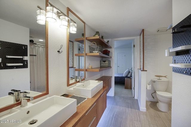 1750 E Mallory St, Mesa, AZ 85203 - full bathroom with double vanity, wood finished floors, and ensuite bath