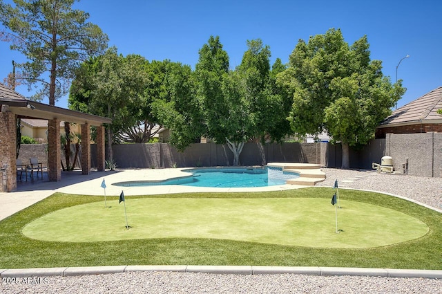 1750 E Mallory St, Mesa, AZ 85203 - view of pool featuring a putting area, a fenced backyard, and a patio area