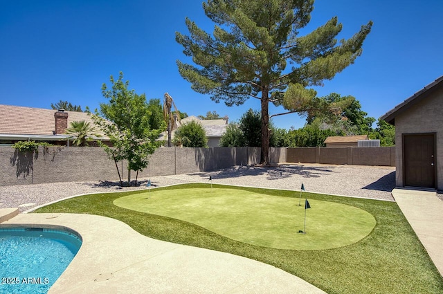 1750 E Mallory St, Mesa, AZ 85203 - fenced backyard featuring a putting green and a patio