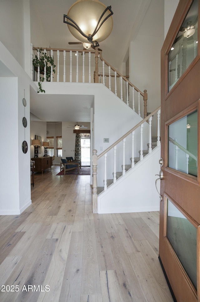 1750 E Mallory St, Mesa, AZ 85203 - entrance foyer featuring a high ceiling, ceiling fan, stairs, and wood finished floors