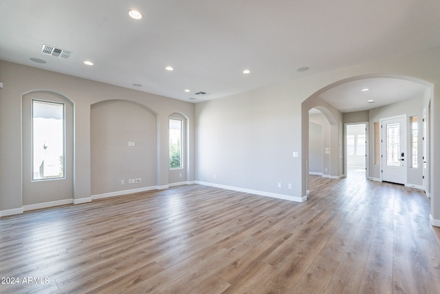 spare room with light hardwood / wood-style floors