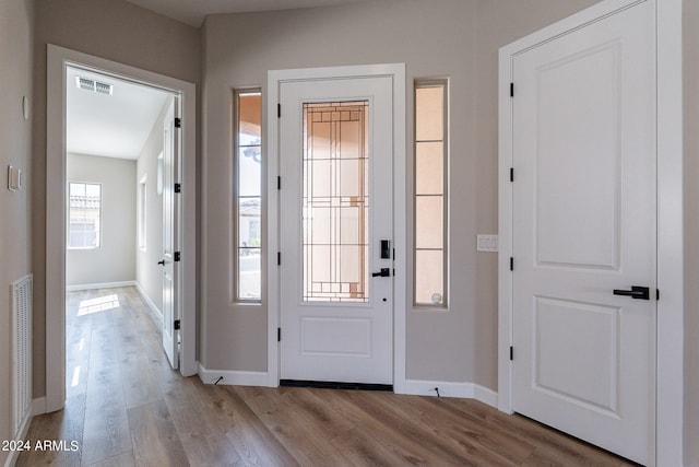 foyer with light hardwood / wood-style flooring