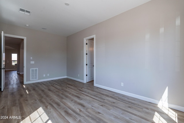 spare room featuring light wood-type flooring