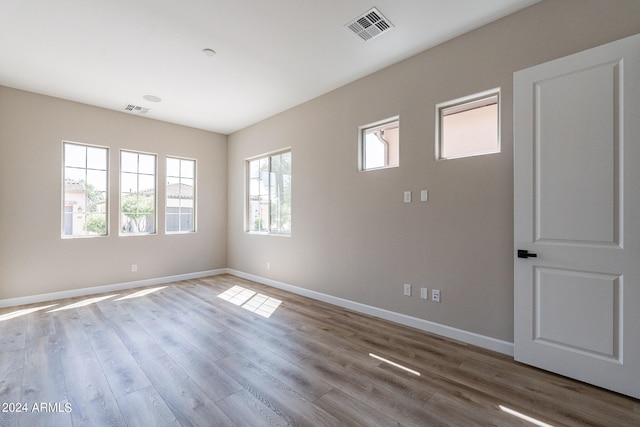 empty room featuring hardwood / wood-style flooring