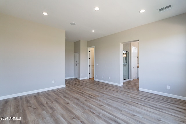 unfurnished room with light hardwood / wood-style flooring