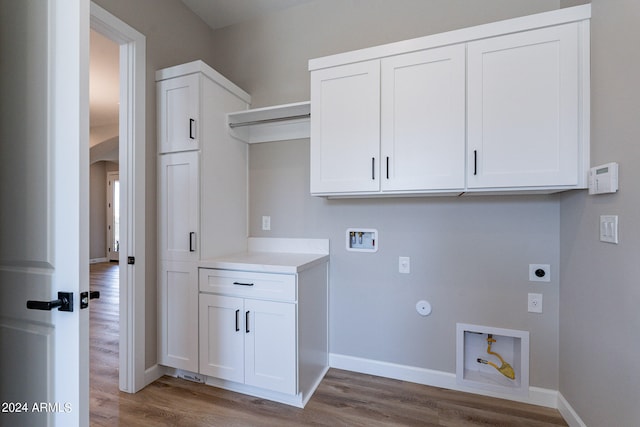 laundry area with light hardwood / wood-style floors, gas dryer hookup, electric dryer hookup, and washer hookup