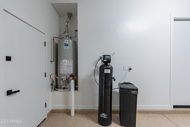 utility room featuring water heater