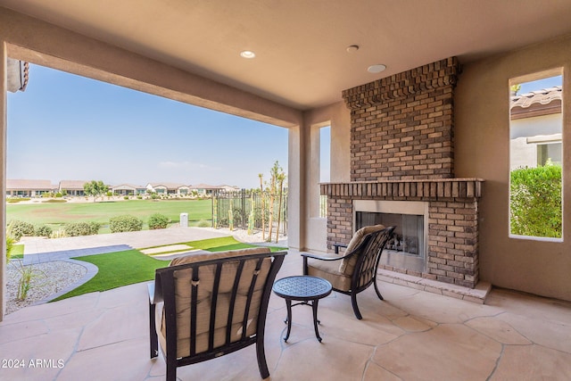 view of patio / terrace with an outdoor brick fireplace