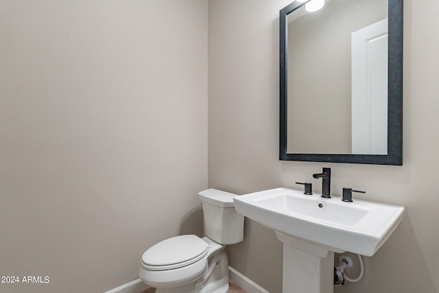 bathroom with toilet and sink