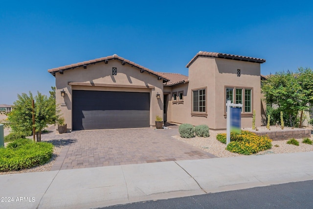 mediterranean / spanish-style house featuring a garage