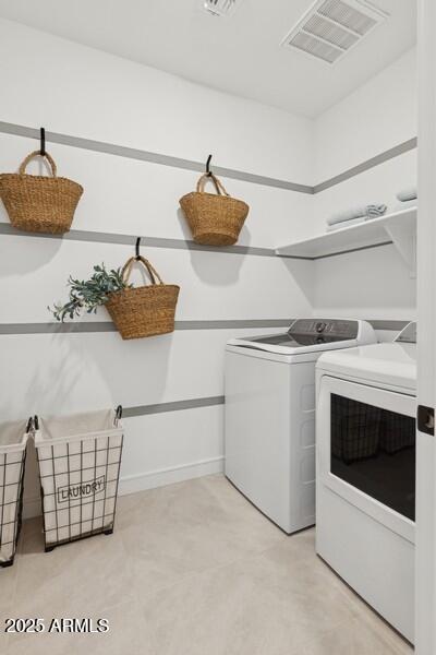 laundry room featuring washing machine and dryer