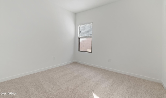 unfurnished room featuring carpet