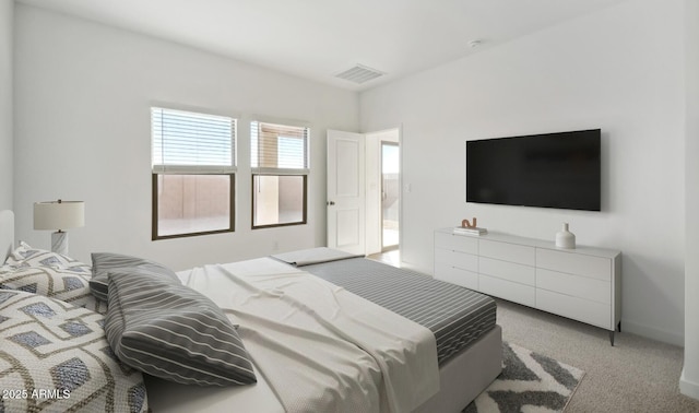 bedroom featuring light carpet