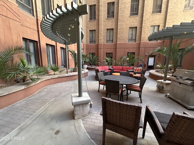 114 W Adams St Unit 302, Phoenix, AZ 85003 - view of patio featuring outdoor dining area, area for grilling, and an outdoor living space