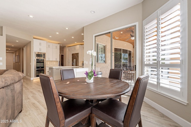 dining area featuring recessed lighting, baseboards, and light wood-style flooring