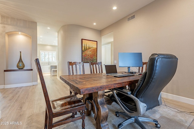 home office featuring light wood-style flooring, recessed lighting, baseboards, and visible vents