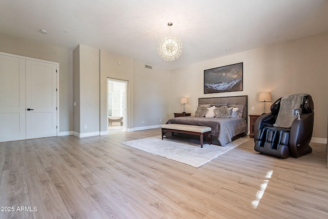 bedroom with visible vents, an inviting chandelier, baseboards, and light wood-style floors