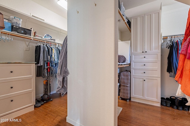 walk in closet featuring light wood-type flooring