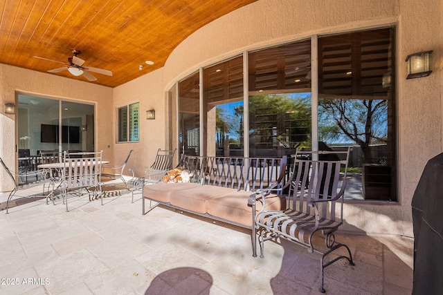 view of patio featuring outdoor dining space and ceiling fan