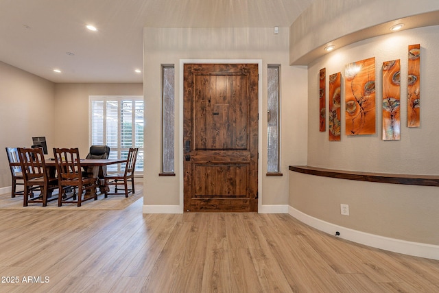 entryway featuring recessed lighting, baseboards, and wood finished floors