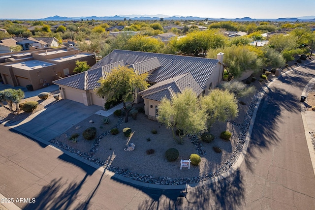 birds eye view of property featuring a mountain view