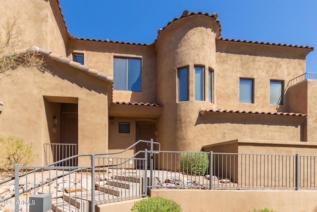 16600 N Thompson Peak Pkwy Unit 1072, Scottsdale, AZ 85260 - exterior space with stucco siding and fence