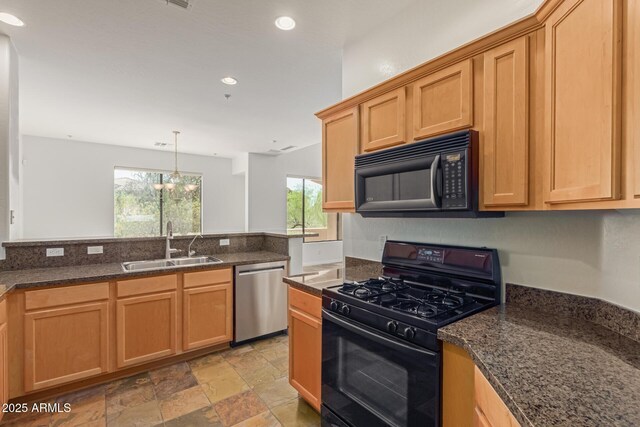 16600 N Thompson Peak Pkwy Unit 1072, Scottsdale, AZ 85260 - kitchen featuring stone finish flooring, a sink, dark stone countertops, black appliances, and recessed lighting