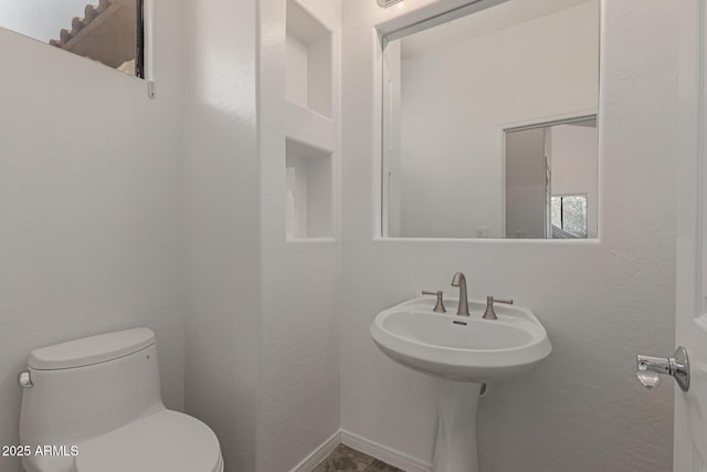 16600 N Thompson Peak Pkwy Unit 1072, Scottsdale, AZ 85260 - half bathroom with baseboards and toilet