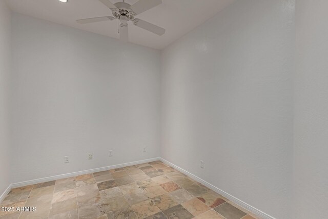 16600 N Thompson Peak Pkwy Unit 1072, Scottsdale, AZ 85260 - unfurnished room featuring a ceiling fan, stone finish floor, and baseboards