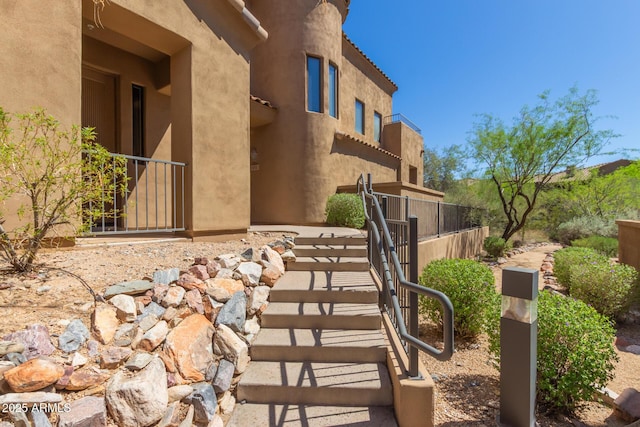 16600 N Thompson Peak Pkwy Unit 1072, Scottsdale, AZ 85260 - exterior space with stucco siding and fence