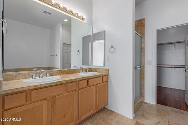 16600 N Thompson Peak Pkwy Unit 1072, Scottsdale, AZ 85260 - full bath with visible vents, a sink, a stall shower, and double vanity