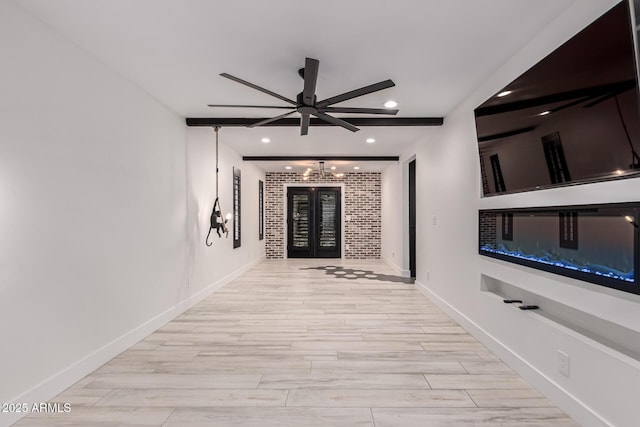hall featuring baseboards, wood finish floors, recessed lighting, and beam ceiling