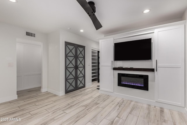 unfurnished living room with baseboards, visible vents, recessed lighting, and light wood-type flooring