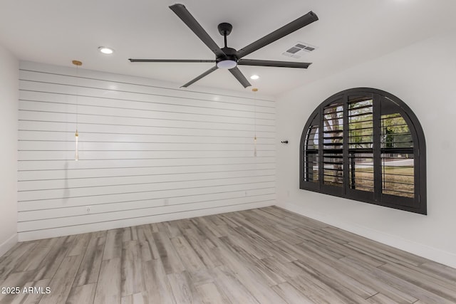 empty room with recessed lighting, baseboards, visible vents, a ceiling fan, and wood finished floors